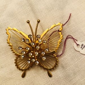 Vintage Monet crystal starburst butterfly pin.